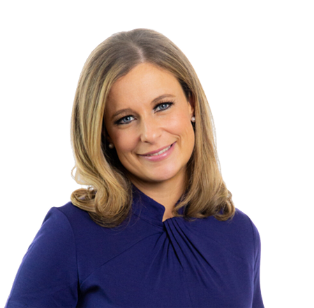 A woman with shoulder-length blonde hair, wearing a dark blue top, smiles softly at the camera against a plain white background.