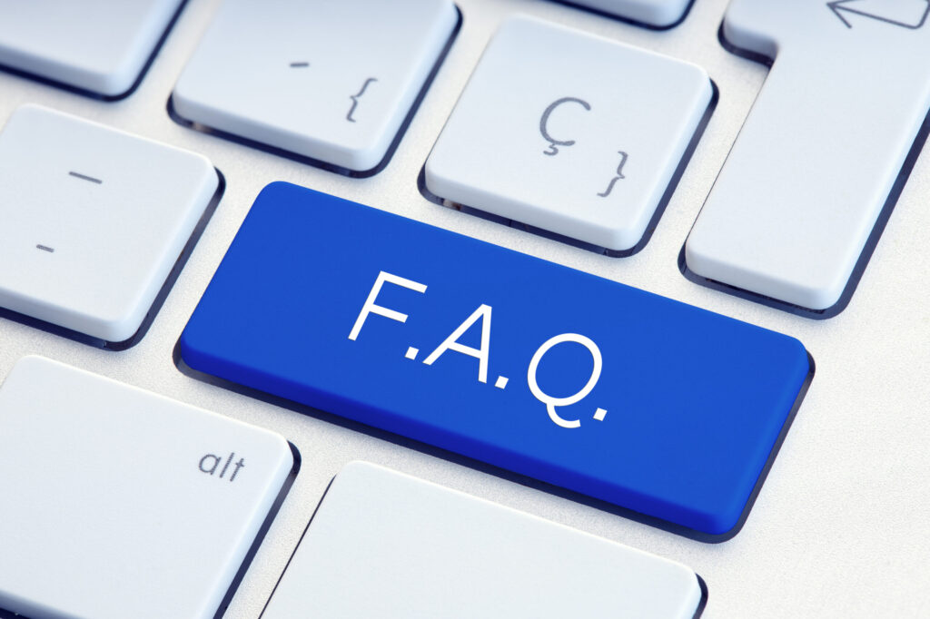 A computer keyboard with a large blue key labeled F.A.Q. in white letters, symbolizing frequently asked questions, surrounded by standard white keys.