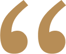 Large, gold-colored opening quotation marks on a light gray background.