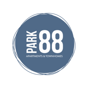 A blue circular logo with a white outline featuring the text PARK 88 in large white letters and APARTMENTS & TOWNHOMES below in smaller font.