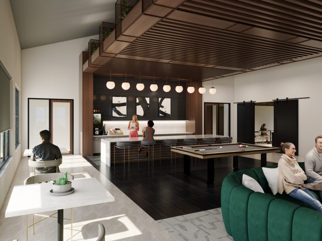 Modern lounge area with people socializing; includes a bar with stools, a ping pong table, a green couch, and large windows letting in natural light. Wooden ceiling accents and hanging lights enhance the space.